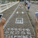 Illustration for article titled A Smartphone Sidewalk Pops Up on a Busy Street in China